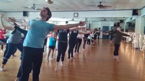 Kate McSwain leading a dance exercise to build core body awareness